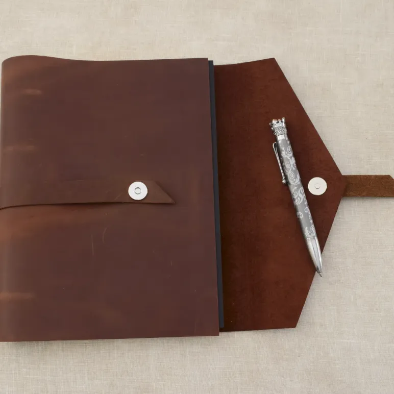 Блокнот из натуральной кожи А5 на кольцах с кнопкой на хлястике